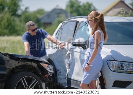 Two drivers having argument over who is guilty in car crash accident. Road safety and insurance concept