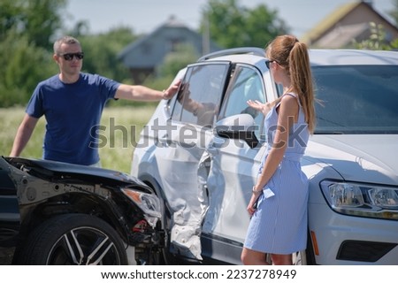 Two drivers having argument over who is guilty in car crash accident. Road safety and insurance concept
