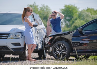 Two drivers talking on mobile phone while calling for help to rescue service in car crash accident. Road safety and insurance concept - Shutterstock ID 2212609225
