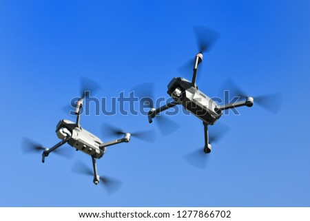 Two drones in flight
