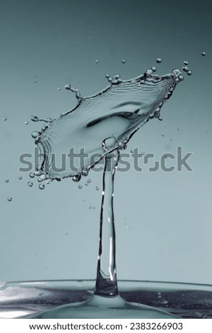 two drops of water colliding 