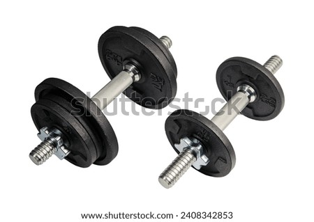 Two dumbbells with changeable weights, studio shot isolated on white background