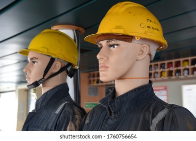 Two dummies in helmets ready to be exposed on the bridge of container vessel passing Gulf of Guinea, West Africa to substitute the real people due to security measures concerning piracy and robbery. - Shutterstock ID 1760756654