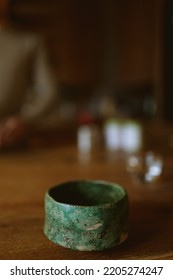 two earthenware cups on a brown table. High quality photo