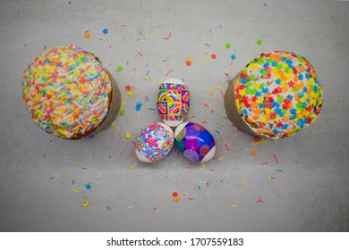 two Easter buns with colorful glaze decoration and chicken eggs with a decorative festive pattern - Shutterstock ID 1707559183