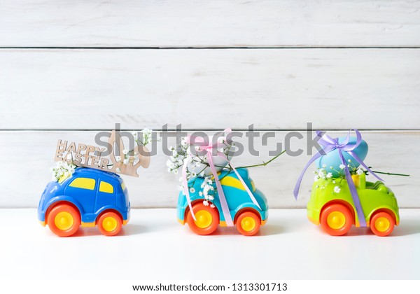 Two Easter cars with an egg and a car with the
inscription 