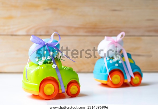 Two Easter cars with an egg and a car with the\
inscription \