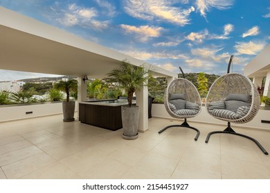 Two egg chair swing on a luxury terrace - Shutterstock ID 2154451927