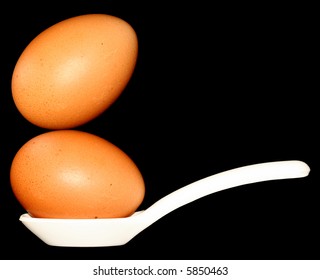 Two eggs balanced on a spoon - good for 
