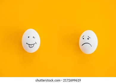Two Eggs and sad   funny face blue background