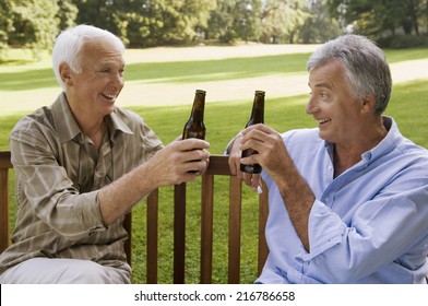 Two elderly men having beer.
