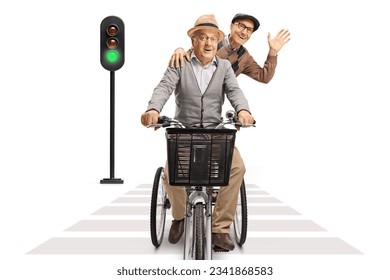 Two elderly men riding on a tricycle towards camera at pedestrian crosswalk isolated on white background - Powered by Shutterstock