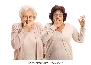 Two elderly women gesturing surprise isolated on white background
