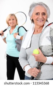 Two Elderly Women Playing Tennis