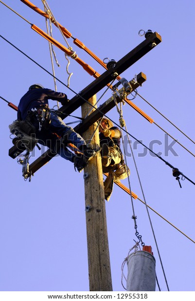 Two Electricians Securing Power Lines On Stock Photo (edit Now) 12955318