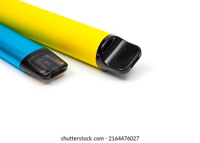 Two electronic cigarettes disposable and refillable with a replaceable cartridge in a blue and yellow body, photographed against a white background