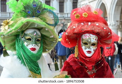 Two elegant and colorful masks in Venice.
 - Shutterstock ID 1896753508