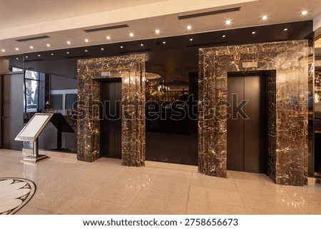 Two elevators in hotel lobby