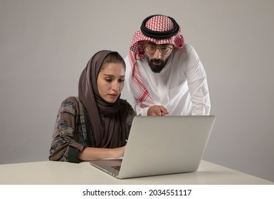 Two employees discussing in the laptop on withe background