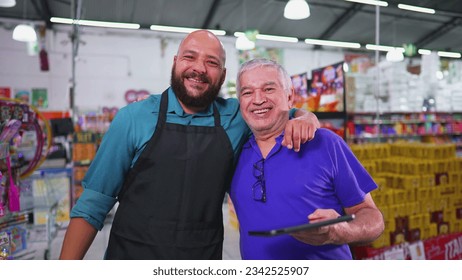 Two employees of Grocery store posing for camera, Brazilian workforce of supermarket, senior manager with staff - Powered by Shutterstock