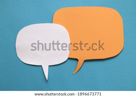 Two empty blank color paper speech bubble balloon dialog for your design, flat lay top view concept