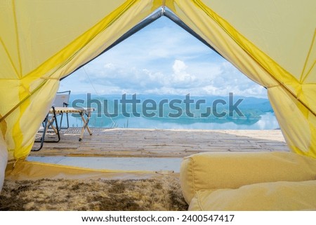 Two Empty Camping Chairs Standing on the Top of the Mount. Perfect Place for Watching Sunset. Actice Relaxation Lifestyle, Tourist tent in camp among with mountain view on sunrise, Travel vacation.
