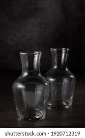 Two Empty Carafe Glasses On Black Background