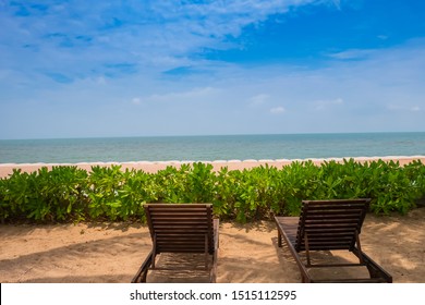 
Two empty chairs on the beach for views of the sea and the blue sky