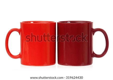 Two empty cups for coffee or tea, isolated on white background