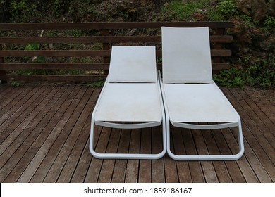 Two empty deck chairs in resort during quarantine of coronavirus in Europe. Pandemic of Covid-19 in 2020 concept