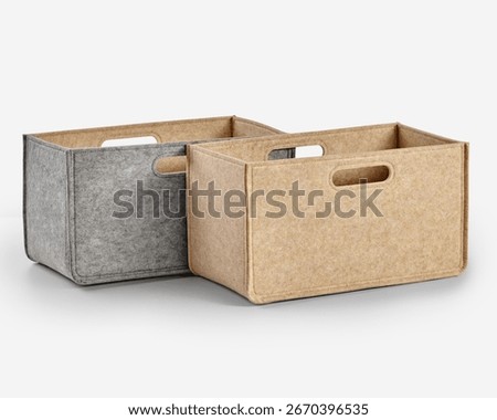 Two empty felt storage boxes with handles for organizing clutter