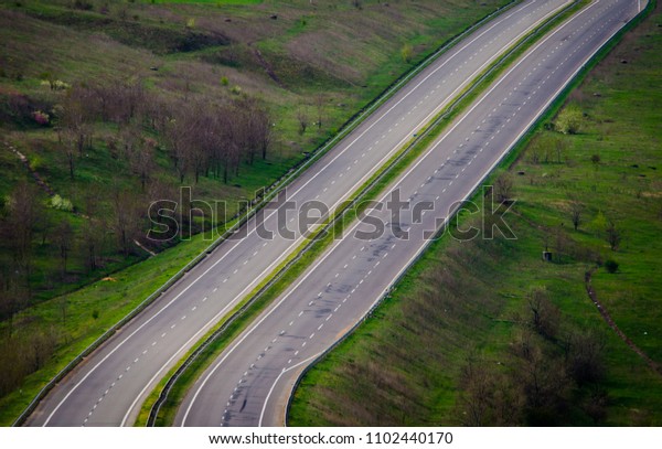 Two empty parallel lanes of a highway without cars\
top view