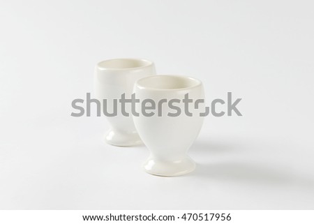 Two empty white porcelain egg cups
