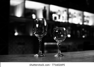 Two Empty Wine Glasses On The Bar Counter Black And White Photo