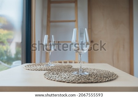 Two empty wine glasses in a table at amazing sunlight. 