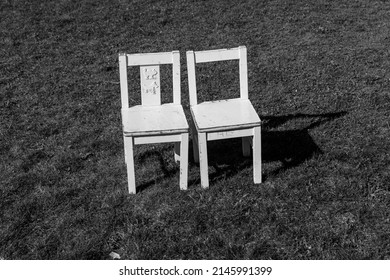 two emty chiars in the grass