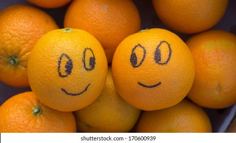 Two Enamored Oranges In A Box