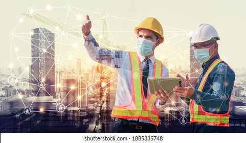 Two Engineer construction holding tablet with Network technology planning development in city 