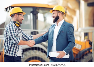 Two Engineer Have Consulting Meeting At Construction Site.