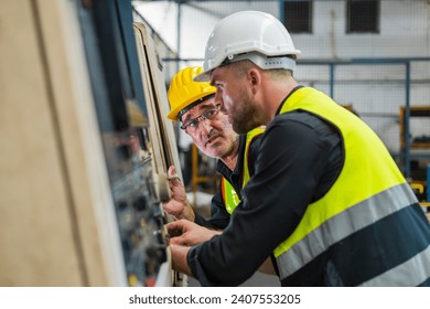 two engineer look projects and planning with tablet mobile in factory