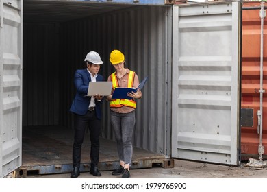 two engineer worker hold a laptop, document for checking a quality of containers box from cargo ship for export and import, blue container background
