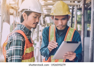 Two Engineer Worker Use Tablet On Site Construction Real Estate Project