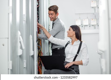 Two IT Engineers in Data Center, Server Room
