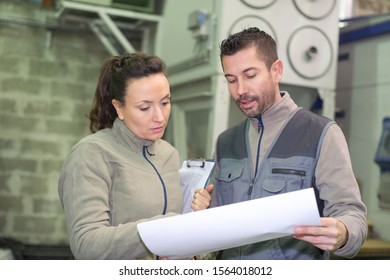 the two engineers with a paper