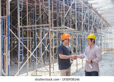 Two engineers working in a construction site
