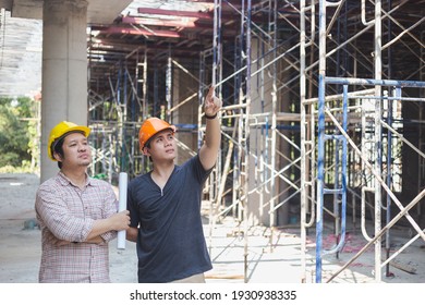 Two engineers working in a construction site