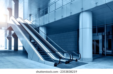 Two escalators in modern office building