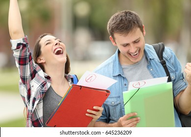 Two excited students with approved exams in the street