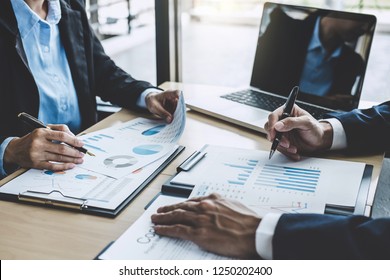 Two executive discussing company growth project success financial statistics, Partner meeting professional investor working start up project for both company with document, laptop and digital tablet. - Shutterstock ID 1250202400