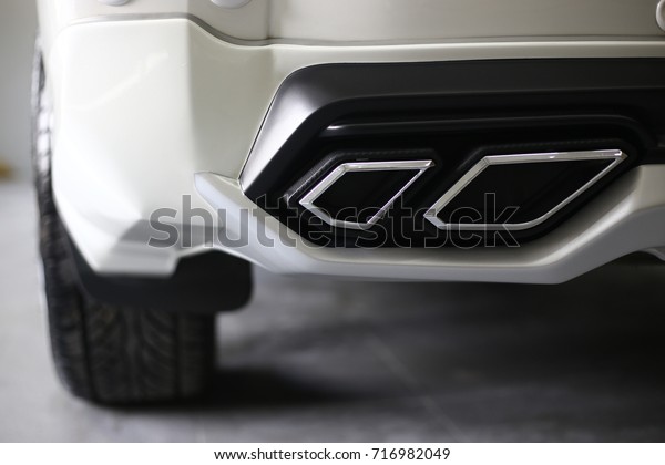  two exhaust pipes.Double exhaust pipes of a\
sports car,selective focus.